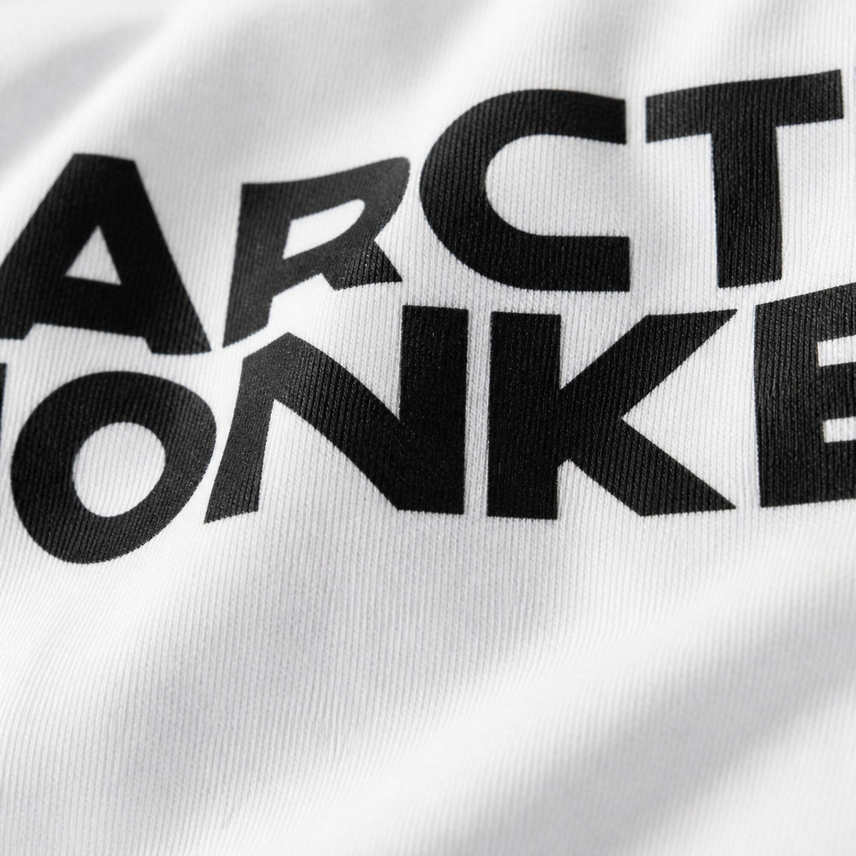 Arctic Monkeys Block Wordmark Tee — print detail close-up