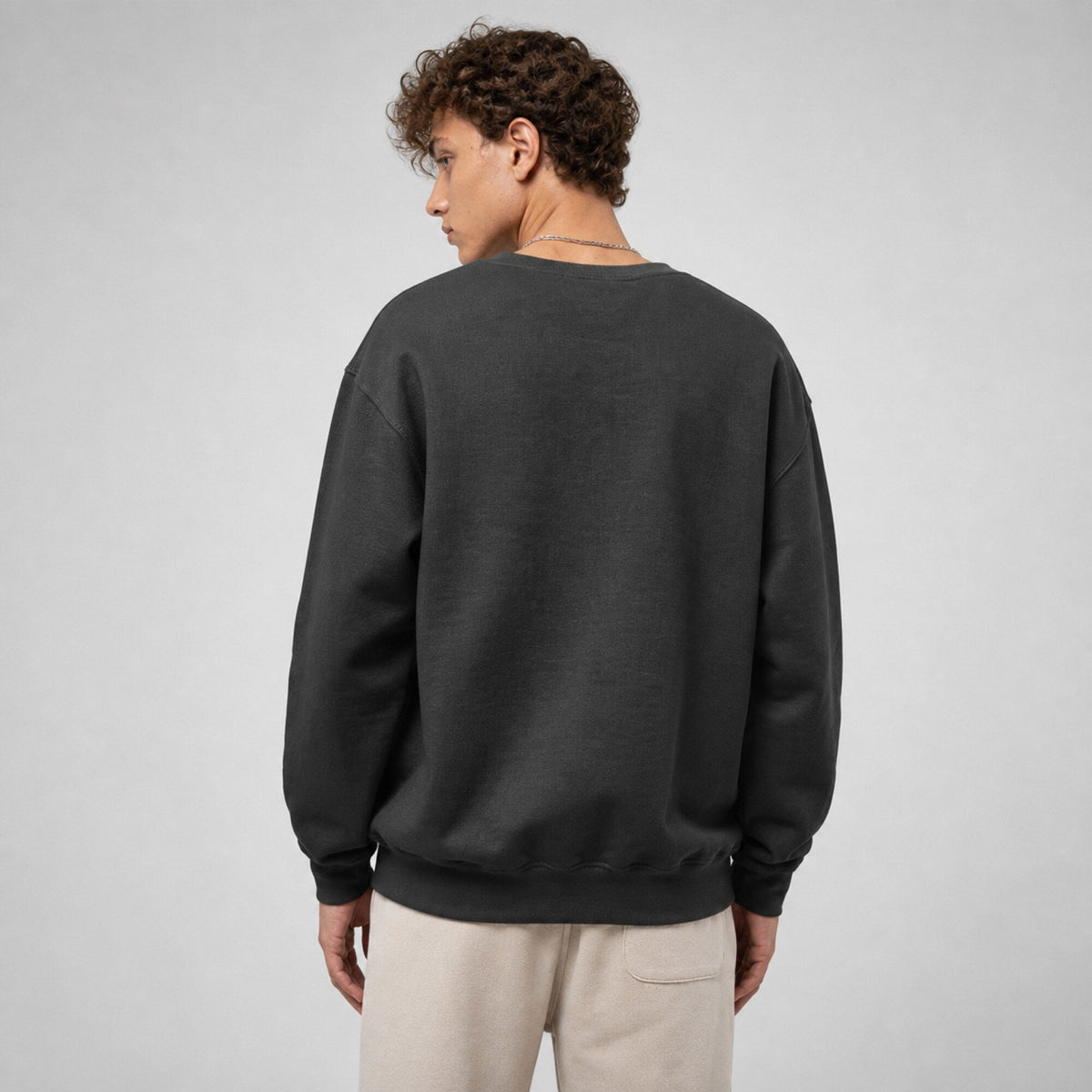 Arctic Monkeys Unisex Premium Sweatshirt — worn on model, back
