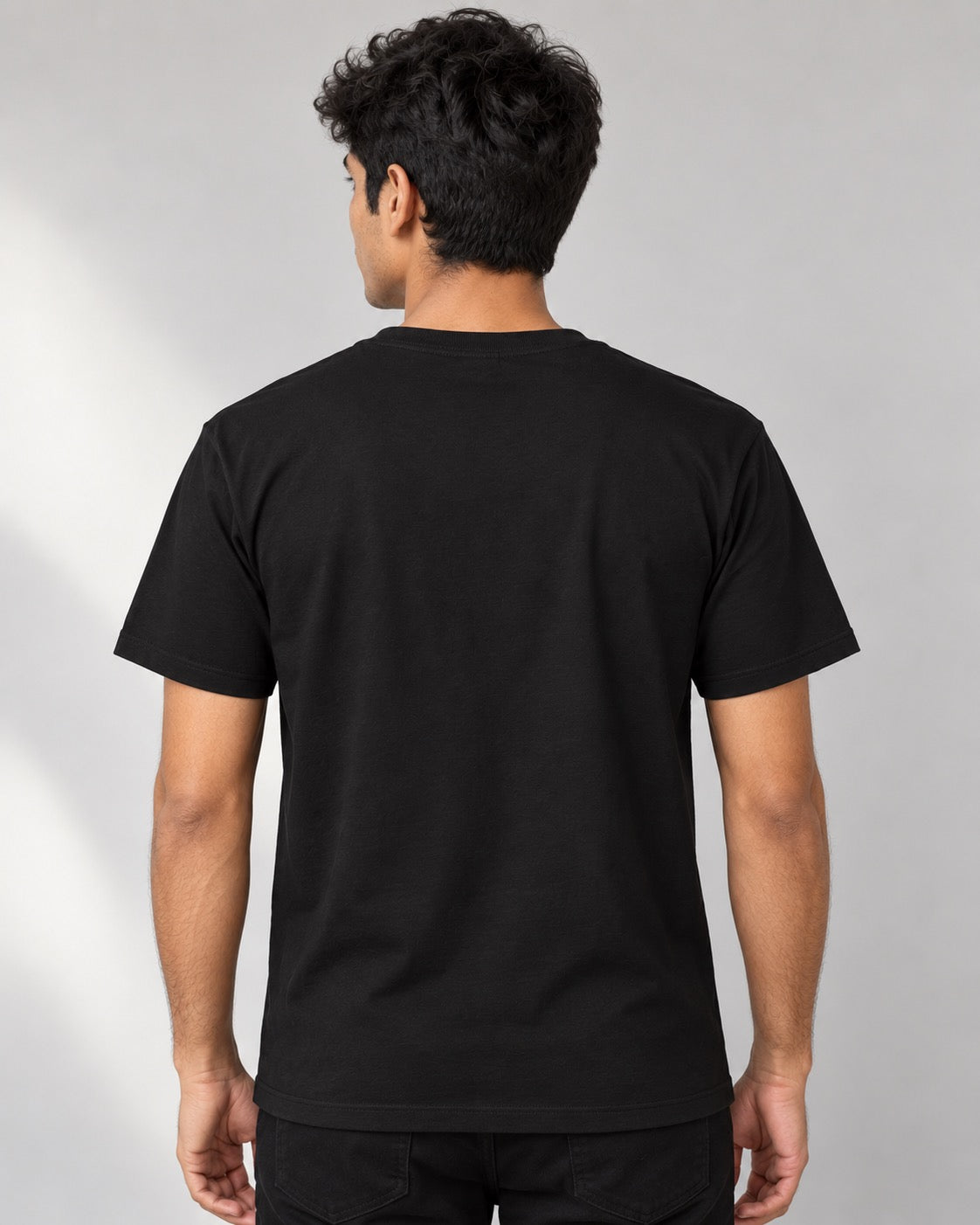 Cat Petting Guide black tee on male model, plain back