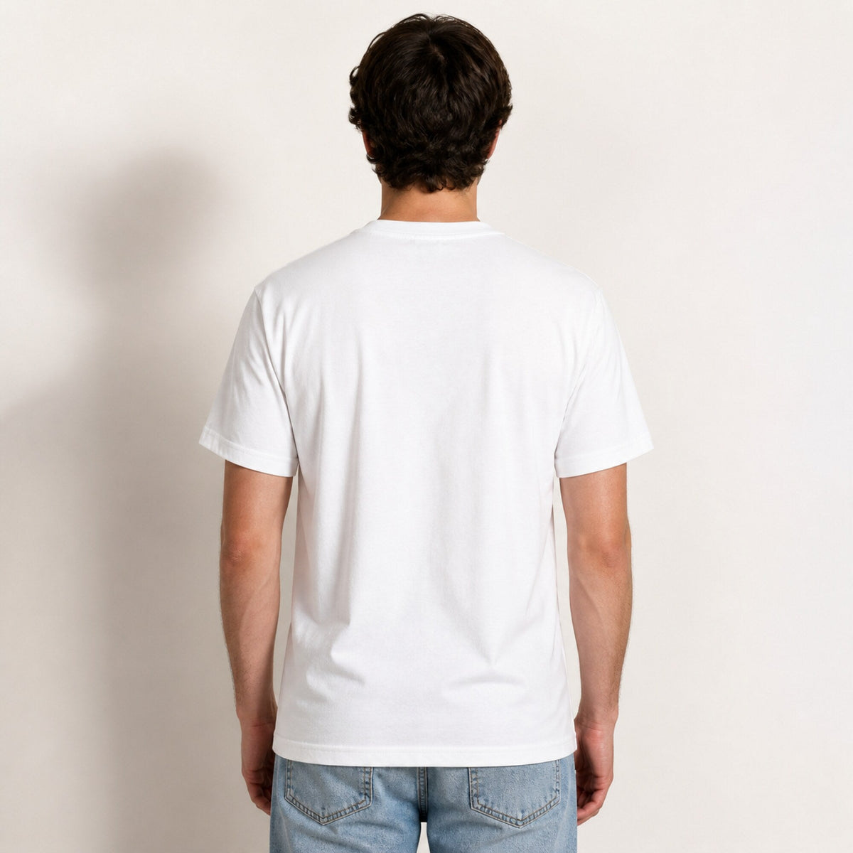 Divine Showdown Unisex T-Shirt — worn on model, back