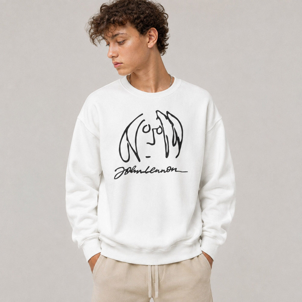 John Lennon- The Beatles Unisex Premium Sweatshirt — worn on model, front