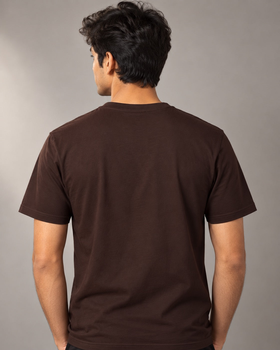 Plain back of the brown I Turn Coffee Into Product Features T-shirt on a male model