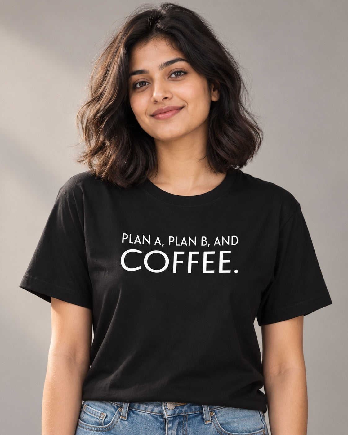 Woman wearing the black Plan A, Plan B, and Coffee T-shirt, front view