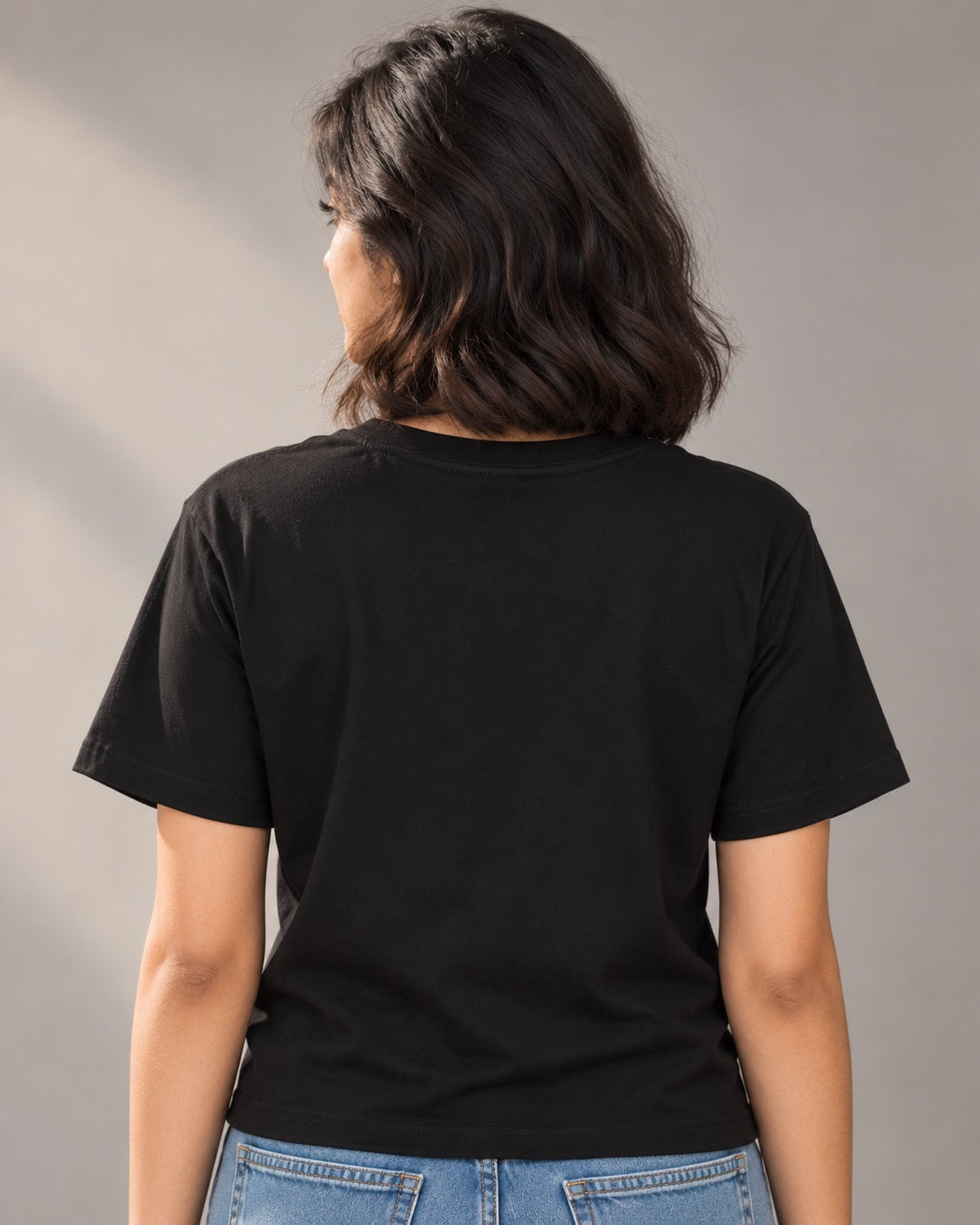 Plain black back of the Plan A, Plan B, and Coffee T-shirt on a woman